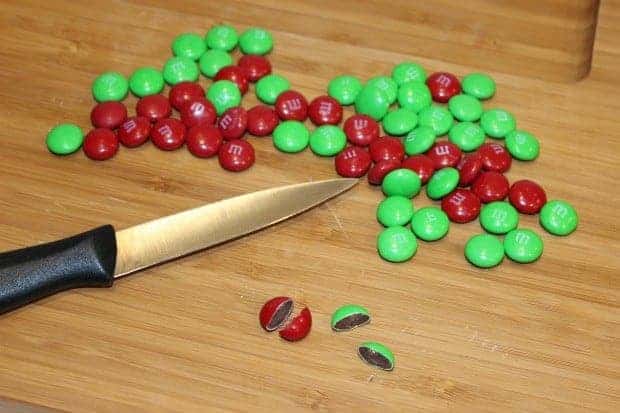 Cut M&Ms with a sharp paring knife for your Christmas Present Pretzels