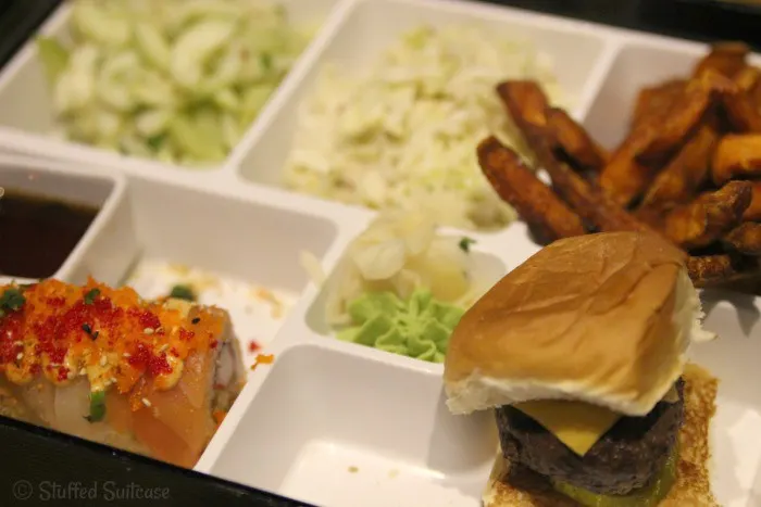 Fusion Specialty Bento Box: mini-burger, sweet potato fries, Thai cucumbers,  fusion specialty roll (firecracker).