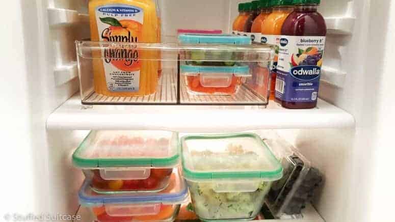 Our fridge was a chaotic mess of bottles and leftovers, with our produce spoiling due to being buried in the bottom drawers. My refrigerator organization project focused on healthy eating and moved the fruits and veggies up!