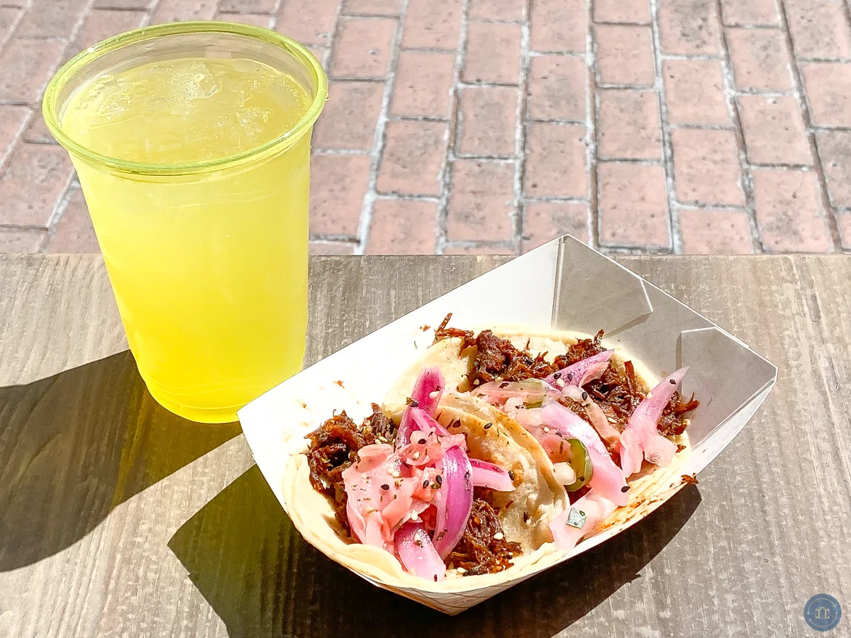 barbacoa street tacos and pineapple margarita on table at touch of disneyland