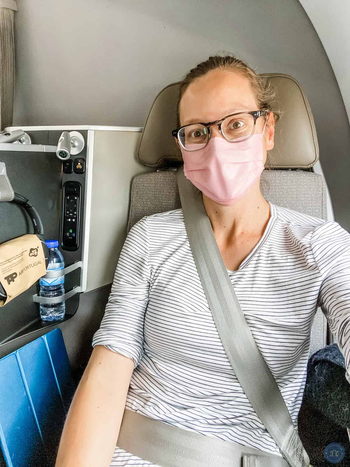 woman sitting in tap airlines business class seat