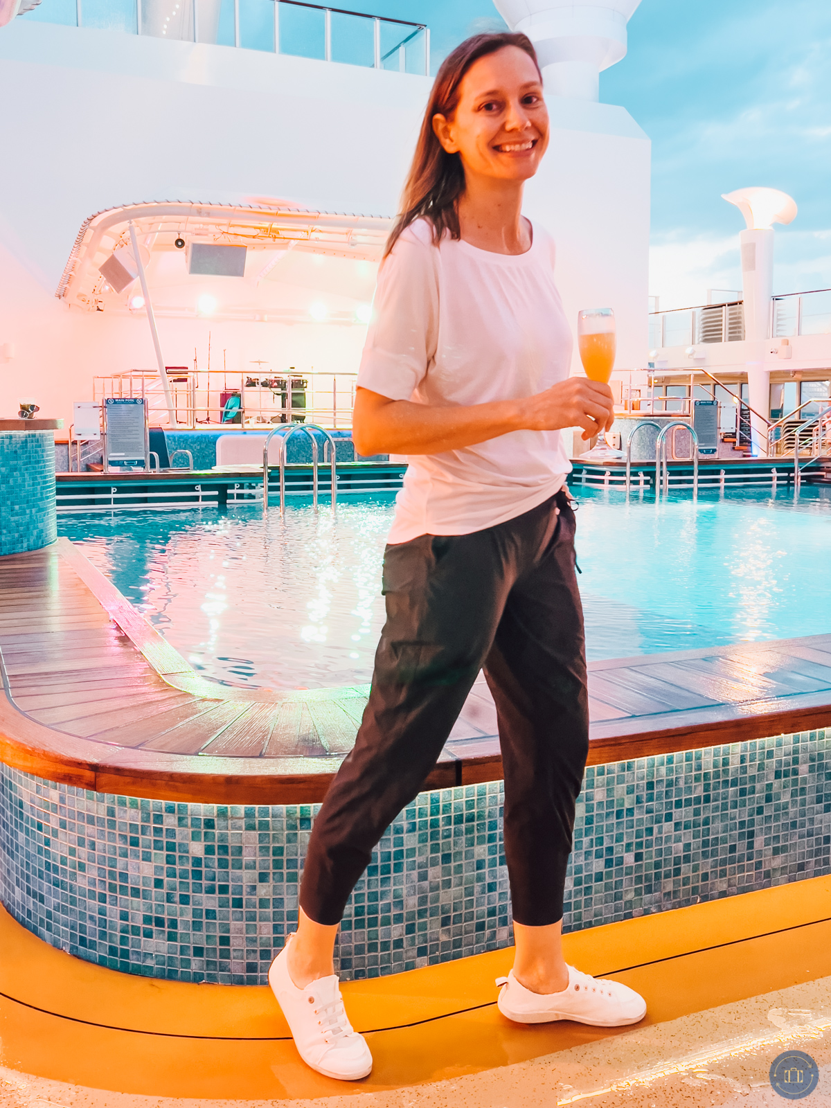 woman wearing white shirt and black joggers on cruise ship