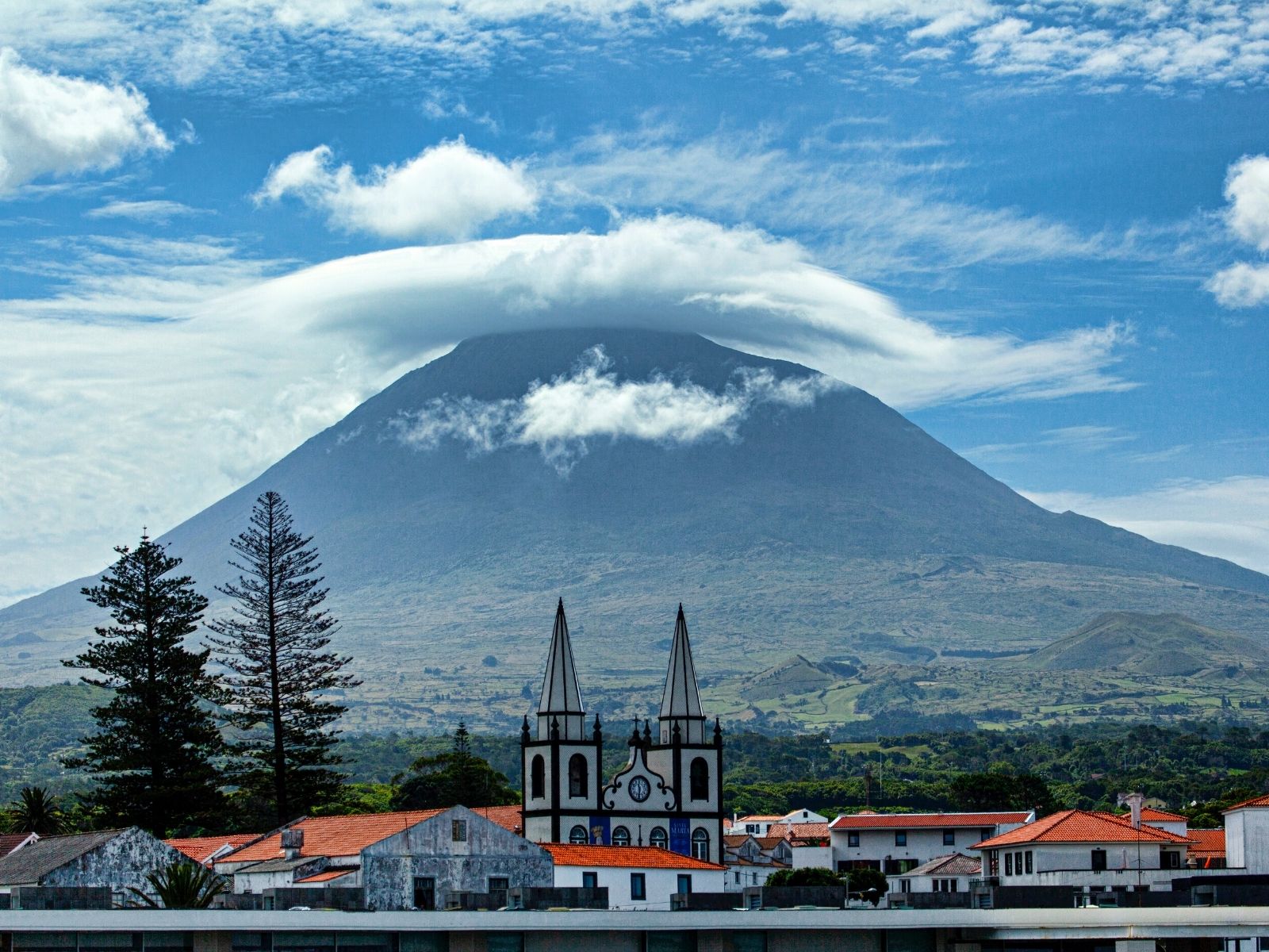pico island town with volcano in background