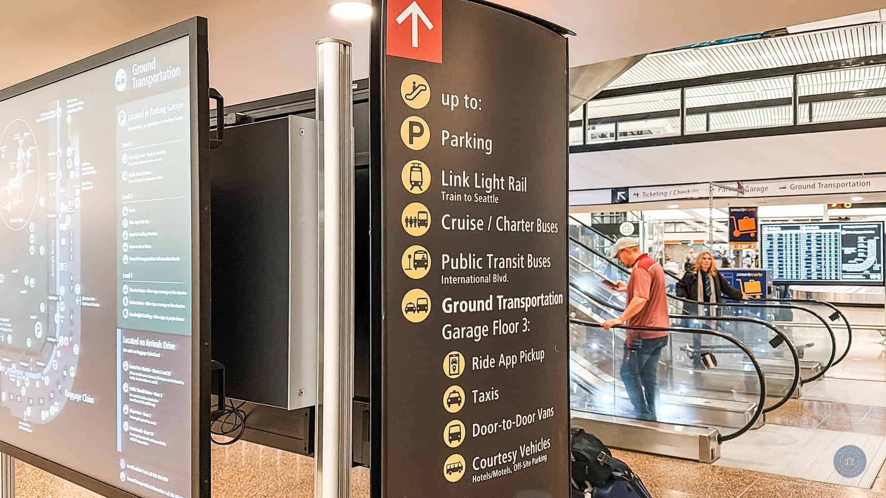 signs at SEA airport baggage claim for link light rail