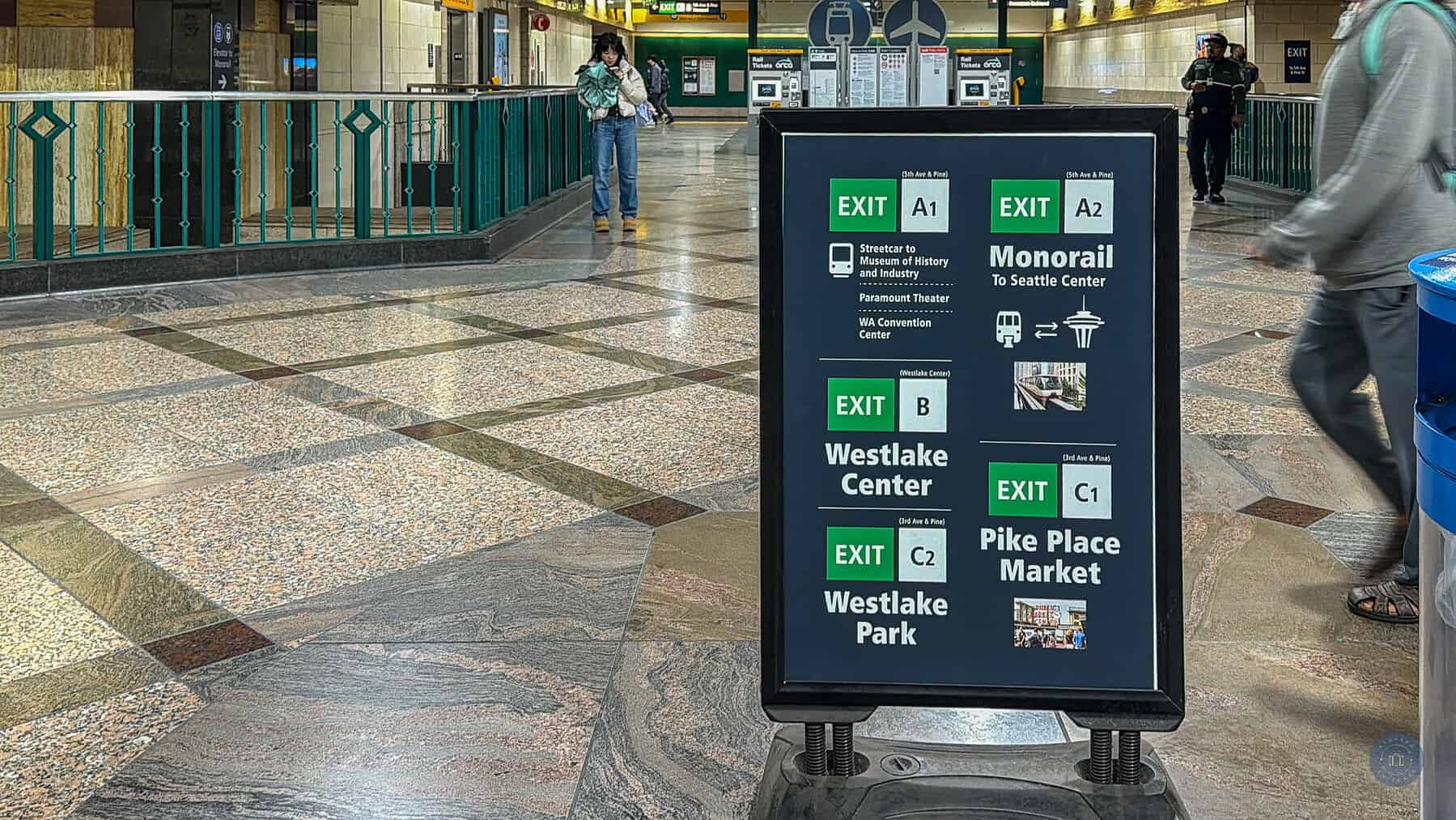 direction sign in the westlake light rail train station in seattle