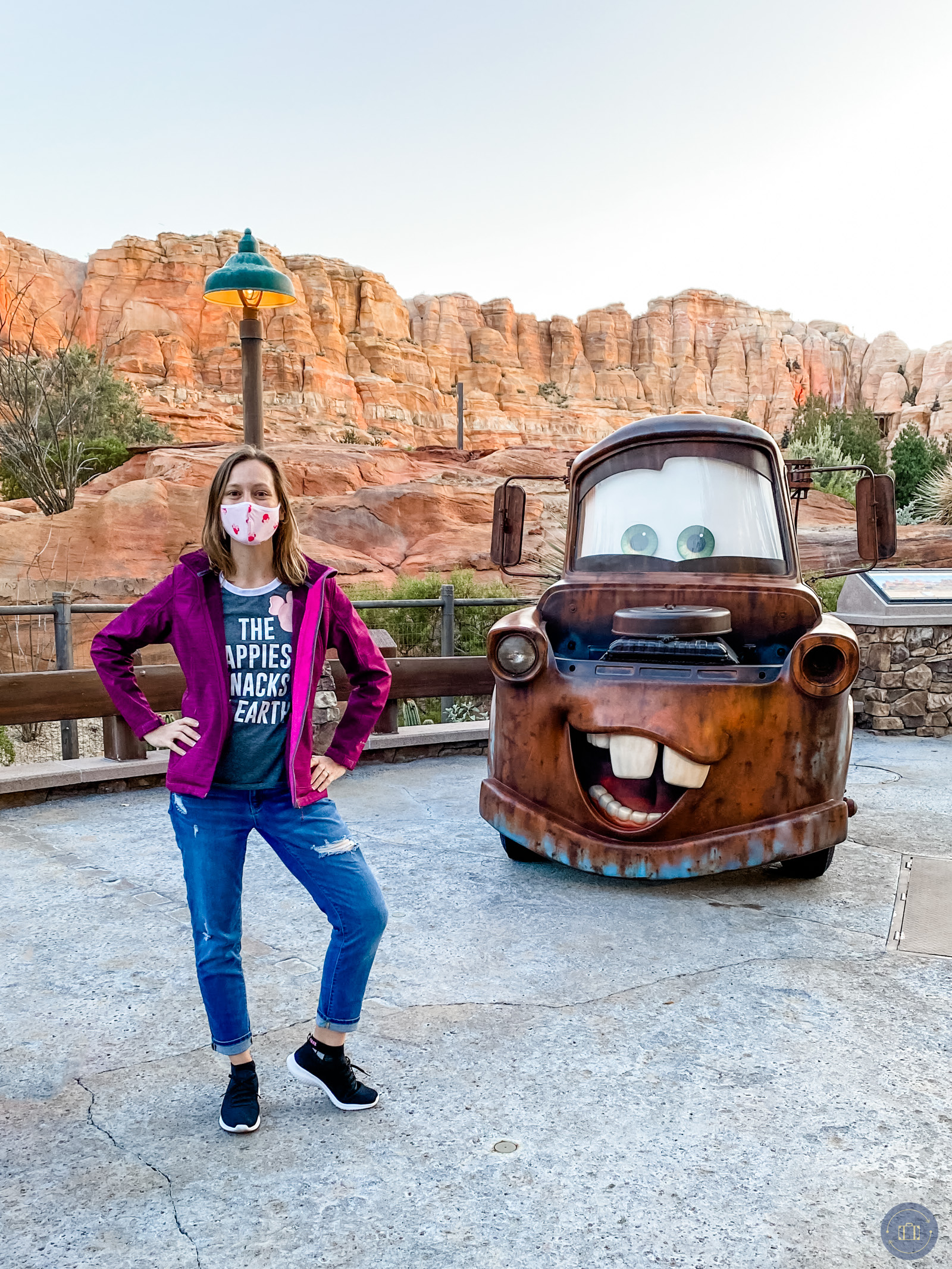 posing with mater at disneyland on a cool morning