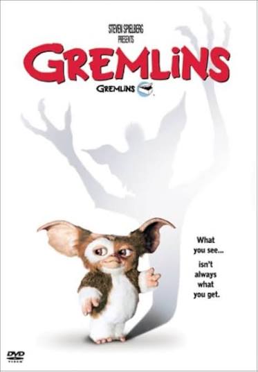 Gizmo the fluffy Mogwai casting a menacing, spiky monster shadow on a white background for a retro 80s movie