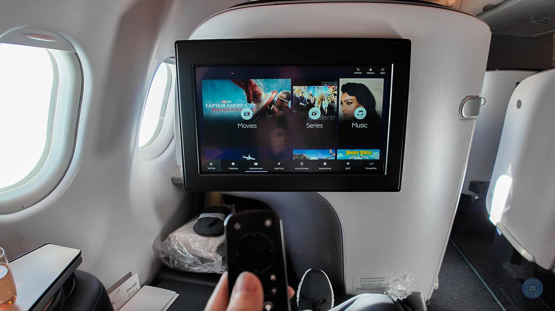 using remote to control finnair business class viewing entertainment