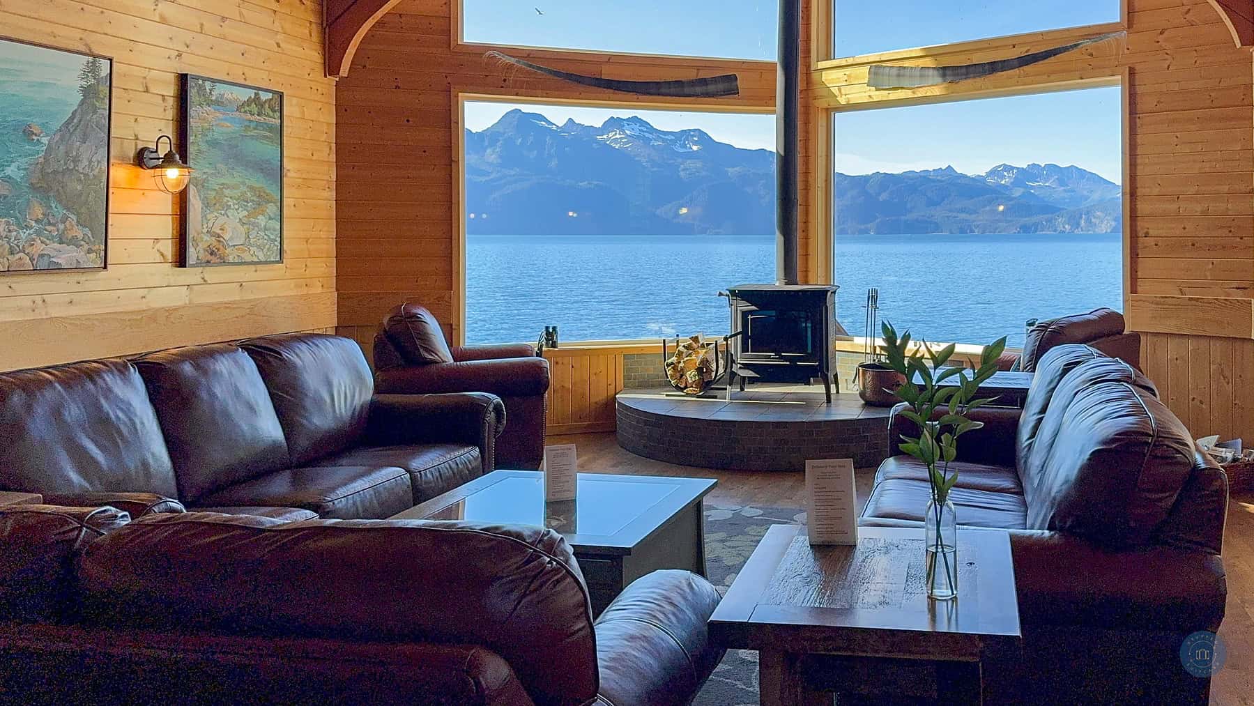 Kenai Fjords Wilderness Lodge lobby with a view of the mountains and water.