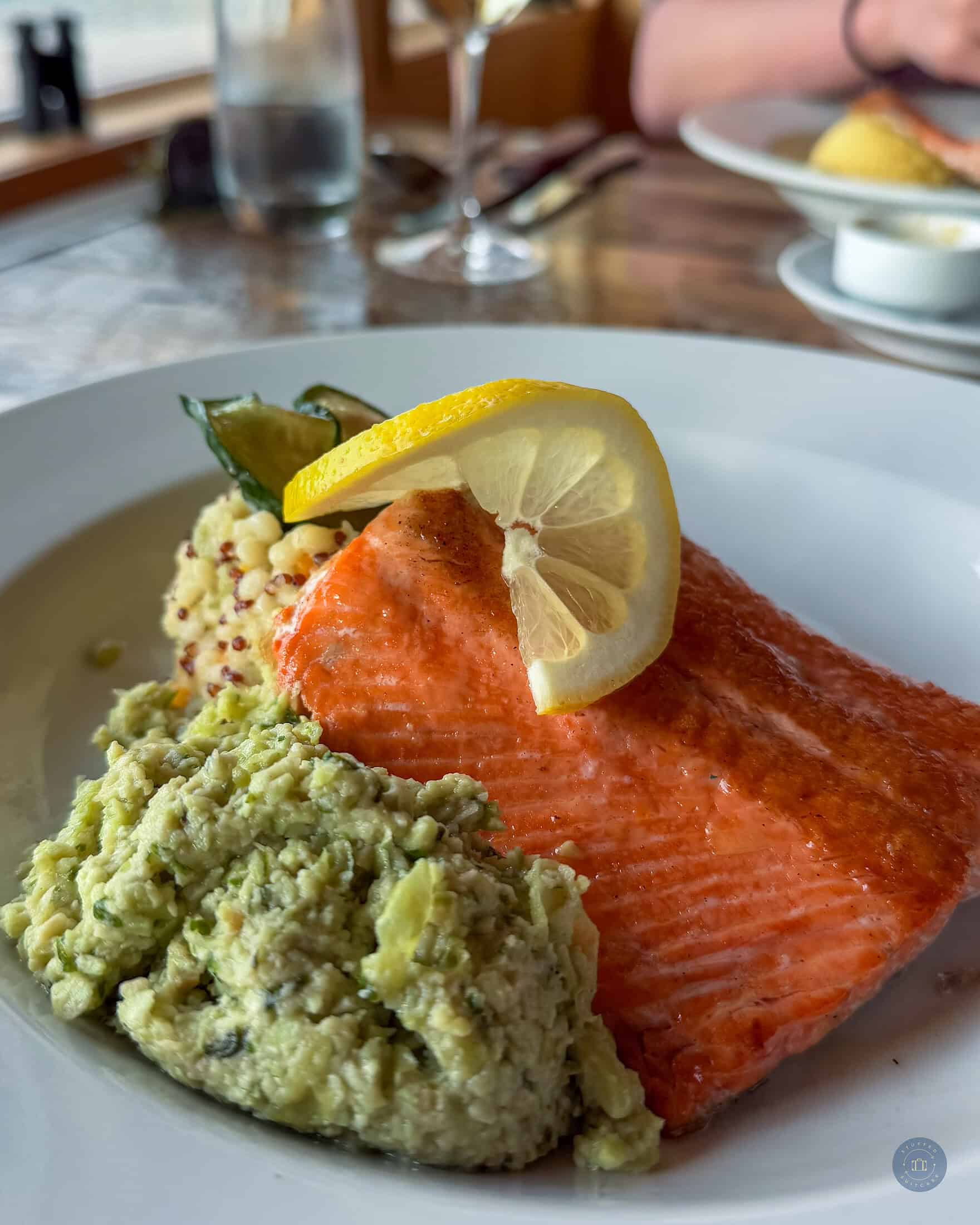Dinner meal of salmon on plate on table