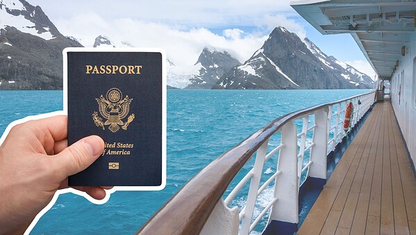 hand holding a passport on alaska cruise with boat railing and glacier mountains in the distance