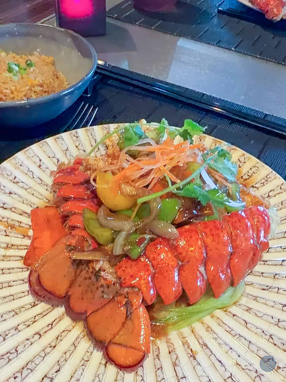 Fresh lobster tail with vegetables and rice in Tamarind restaurant on Holland Alaska cruise.